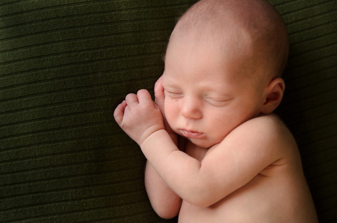 newborn during a relaxed studio portrait session, Twin Cities newborn photographer.